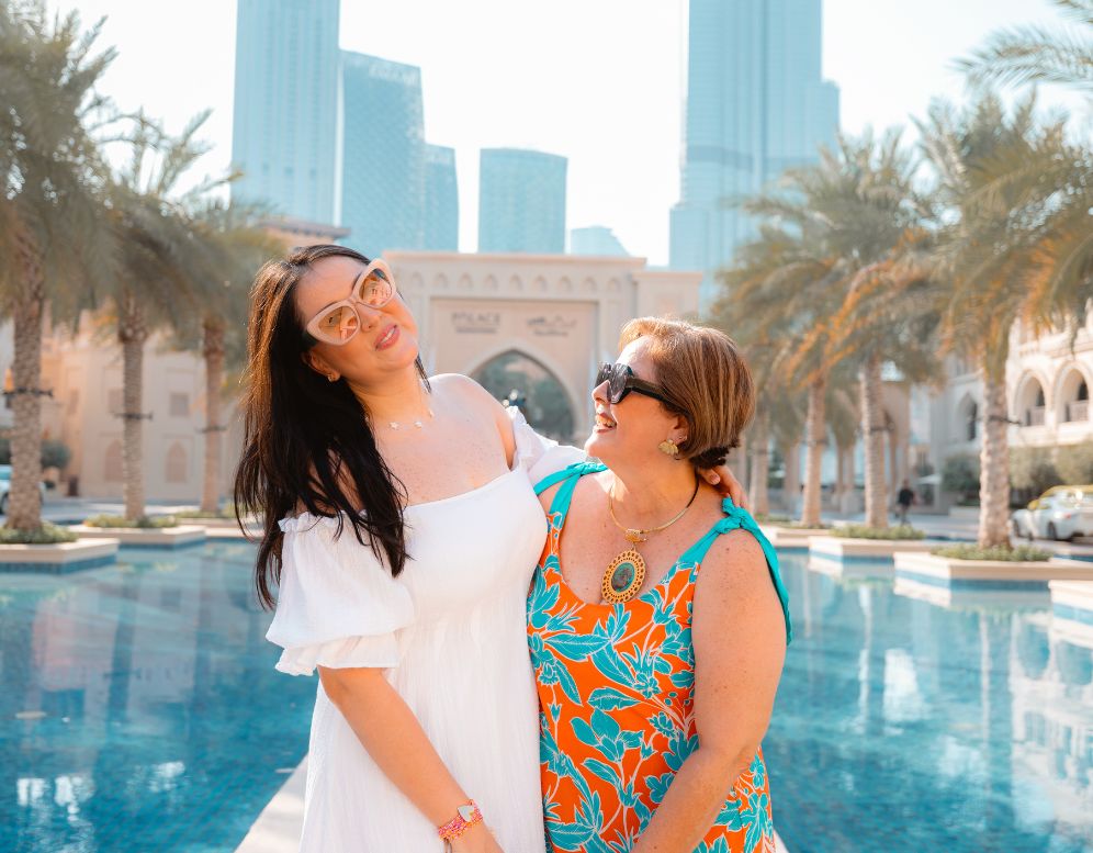 Group photoshoot in Dubai with flying dresses and cityscape background